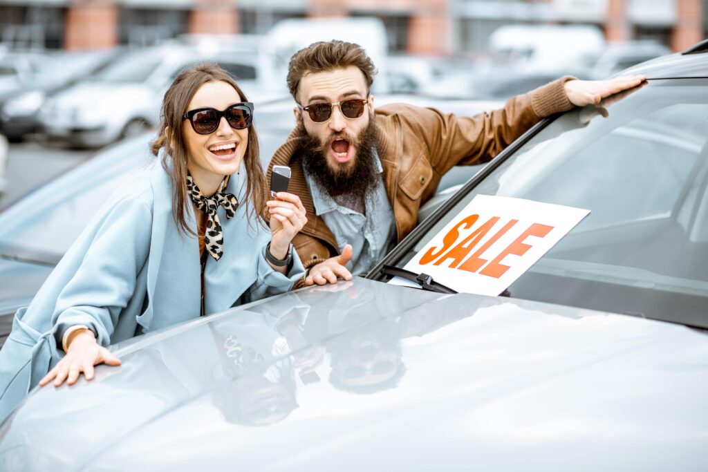 Young couple with car sale